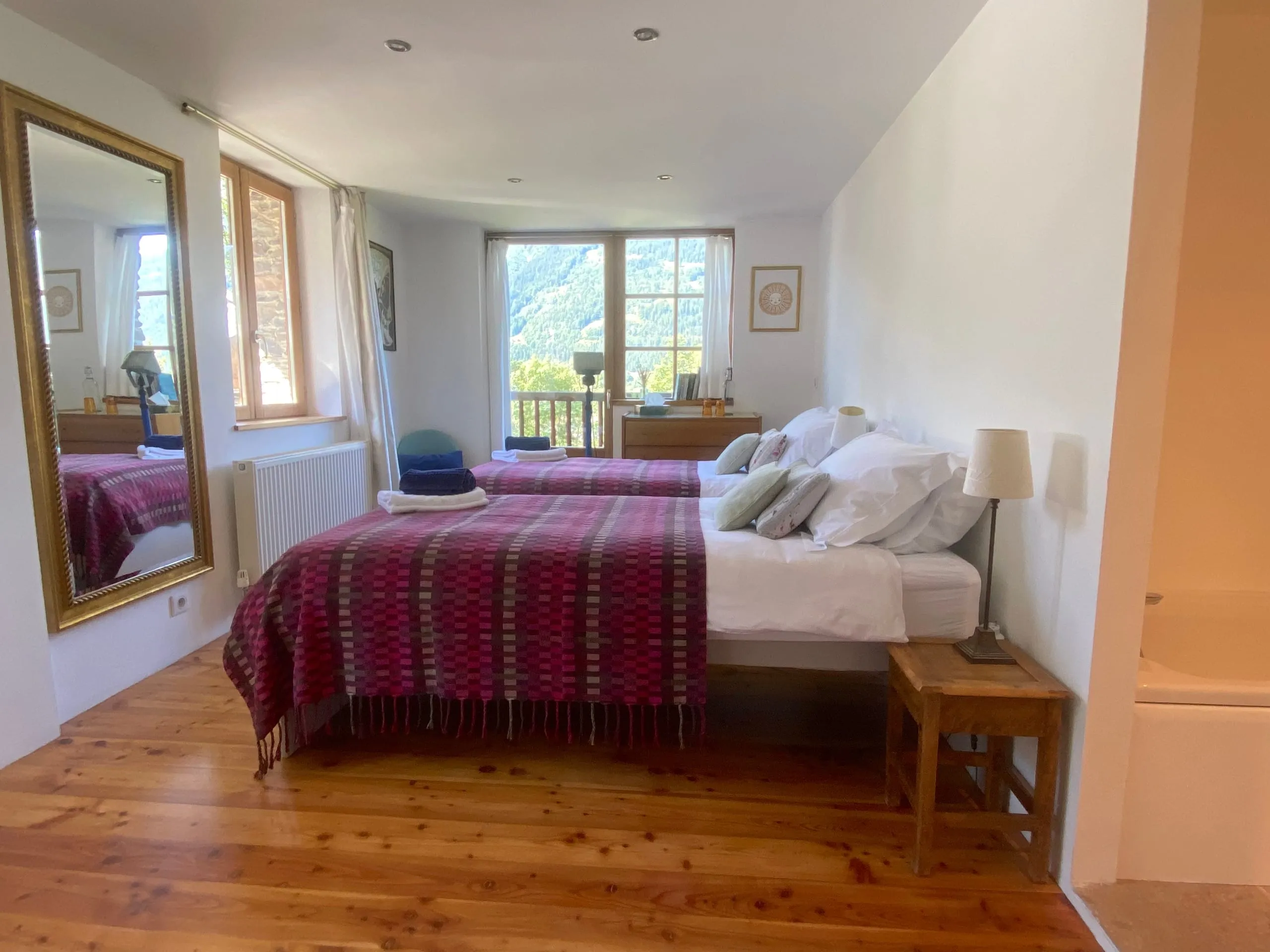 The same room made up as twins, with doors onto the balcony