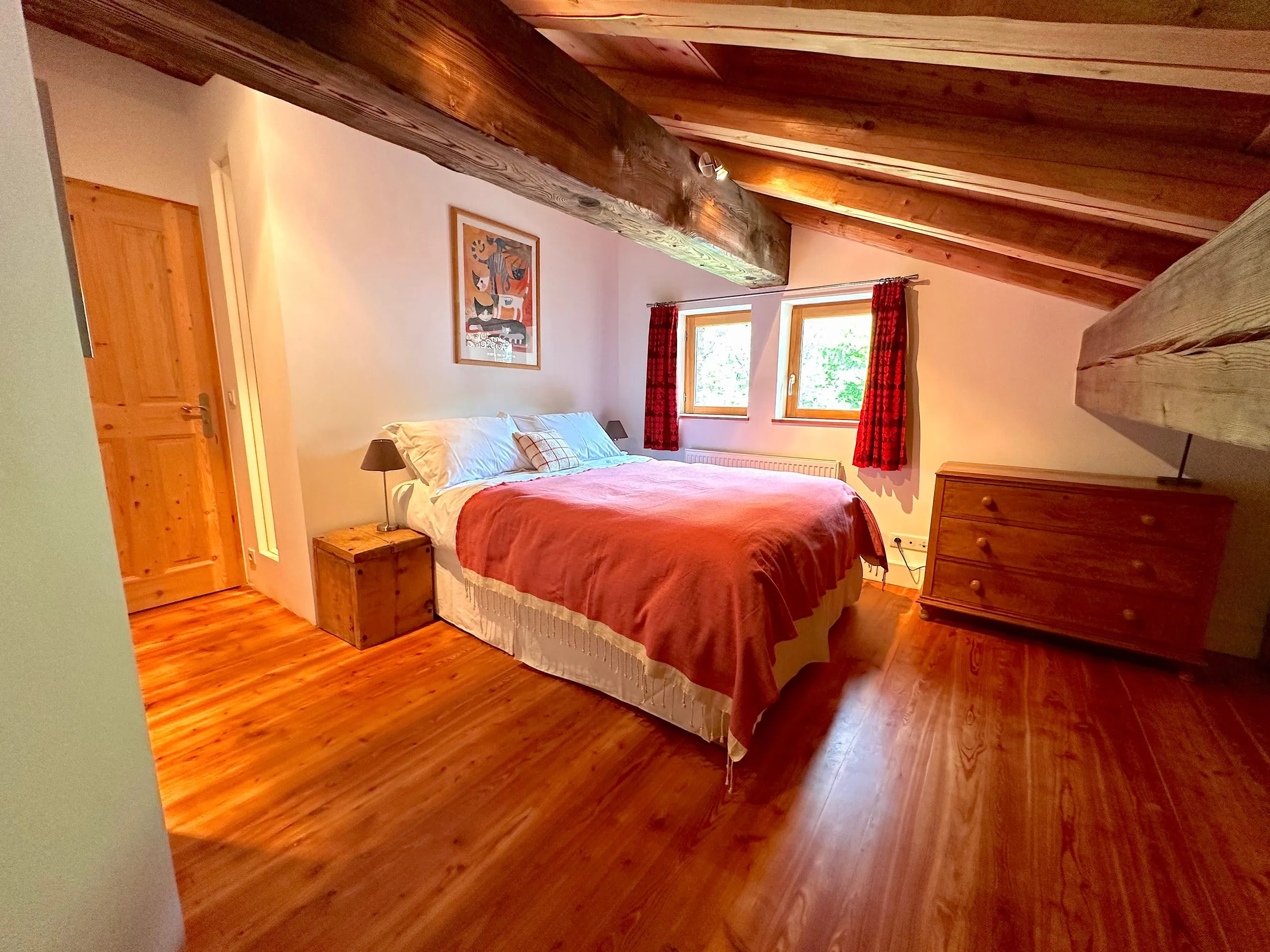 Bedroom three, under the eaves, with old roof beams overhead